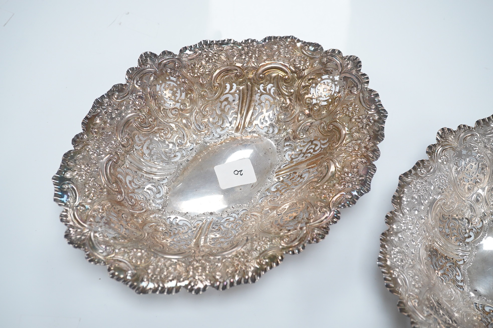 A pair of late Victorian pierced silver oval dishes, by Atkin Brothers, Sheffield, 1896, 27.9cm, 19.7oz. Condition - fair to good